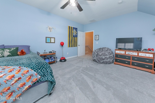 bedroom featuring ceiling fan, vaulted ceiling, and carpet flooring