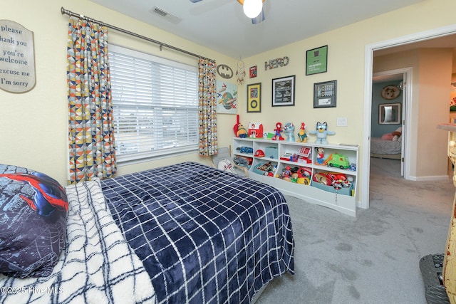 bedroom with ceiling fan and carpet