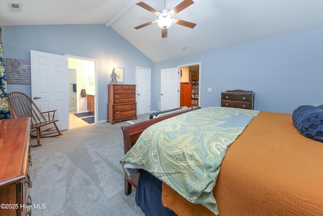 carpeted bedroom featuring ceiling fan, ensuite bath, and lofted ceiling with beams