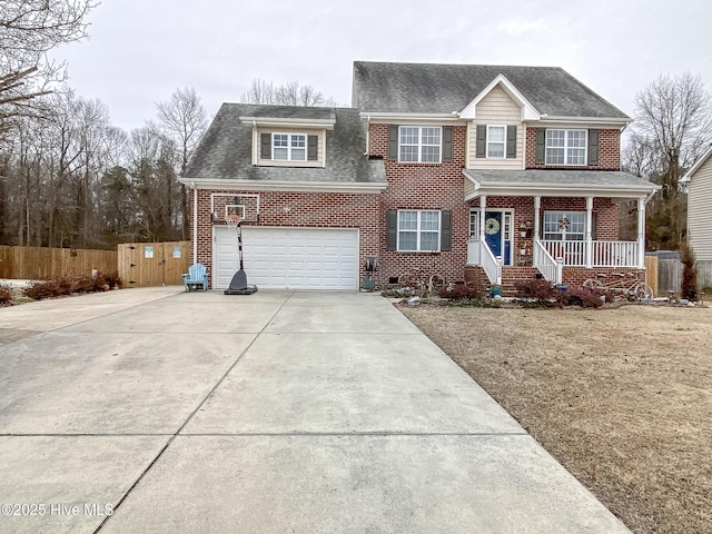 view of front of house with a porch and a garage