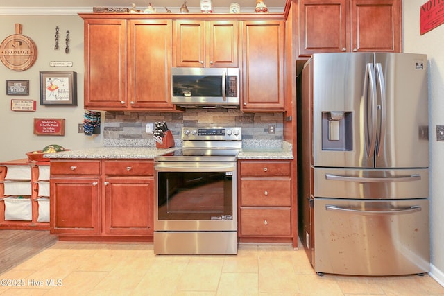 kitchen featuring light stone counters, appliances with stainless steel finishes, ornamental molding, and tasteful backsplash