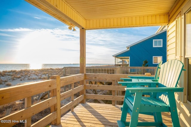 wooden terrace with a water view