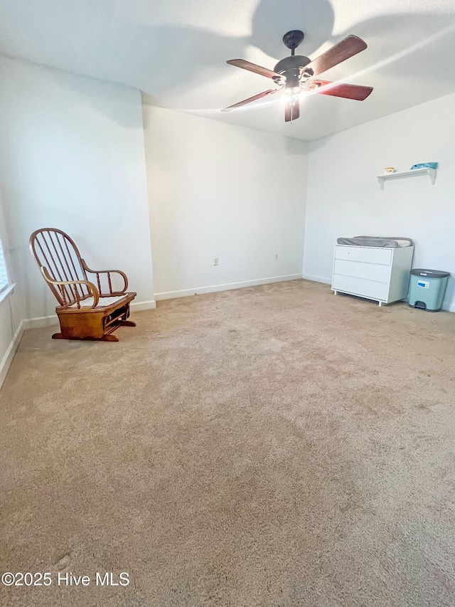 unfurnished room with carpet and ceiling fan