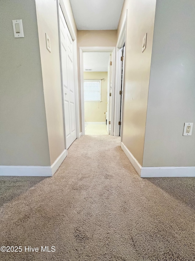 hall with carpet flooring