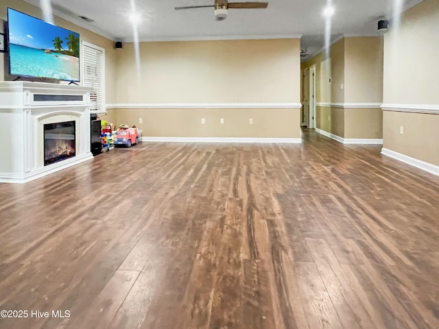 unfurnished living room featuring ceiling fan and wood-type flooring