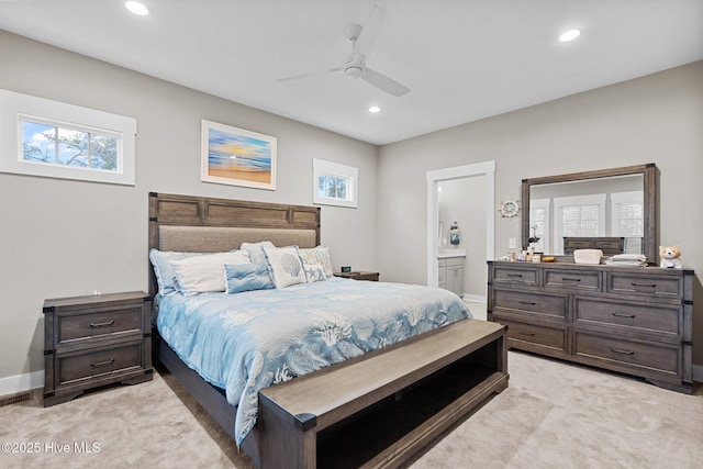 bedroom featuring recessed lighting, light colored carpet, and multiple windows
