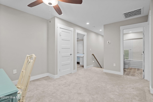 interior space with recessed lighting, visible vents, carpet floors, ensuite bath, and baseboards