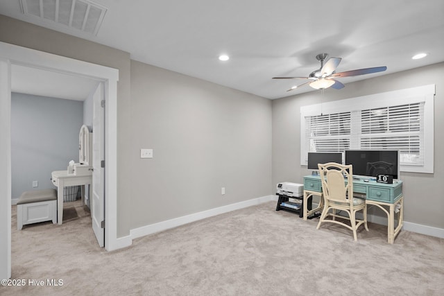 office area with baseboards, visible vents, carpet, and ceiling fan