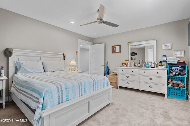 bedroom with light carpet, a ceiling fan, and recessed lighting