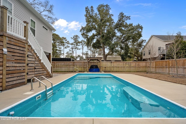 view of pool featuring a fenced backyard, stairs, a patio, and a fenced in pool