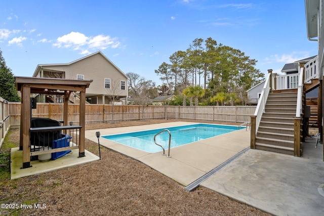 view of pool with a gazebo, a patio area, a fenced backyard, and stairs