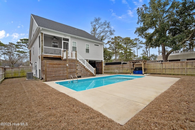 rear view of property with a ceiling fan, a patio, a fenced backyard, and stairs