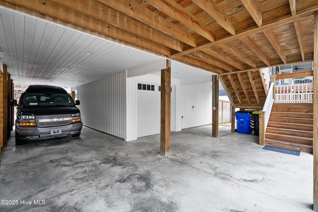 garage with an attached carport