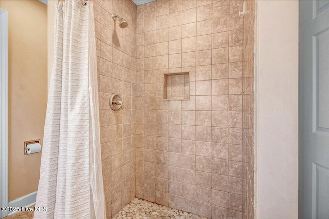 bathroom with a shower with shower curtain