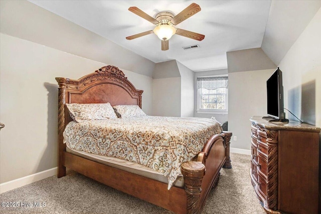 bedroom featuring ceiling fan, vaulted ceiling, and carpet flooring