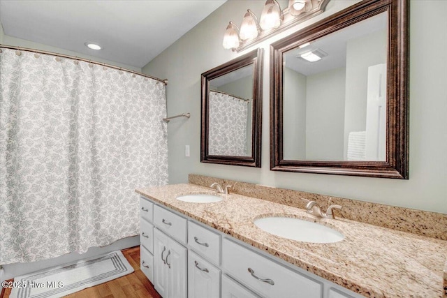 bathroom featuring hardwood / wood-style flooring and vanity