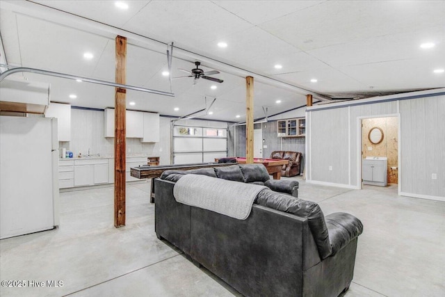 living room featuring ceiling fan and billiards