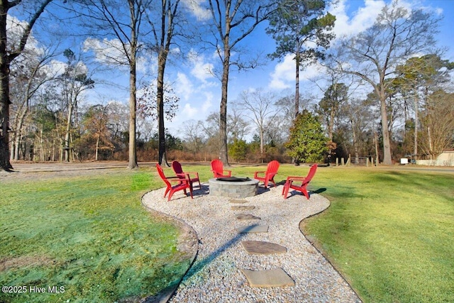 view of yard featuring an outdoor fire pit and a patio area