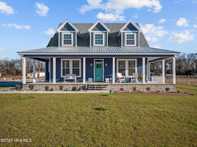 country-style home with covered porch and a front lawn