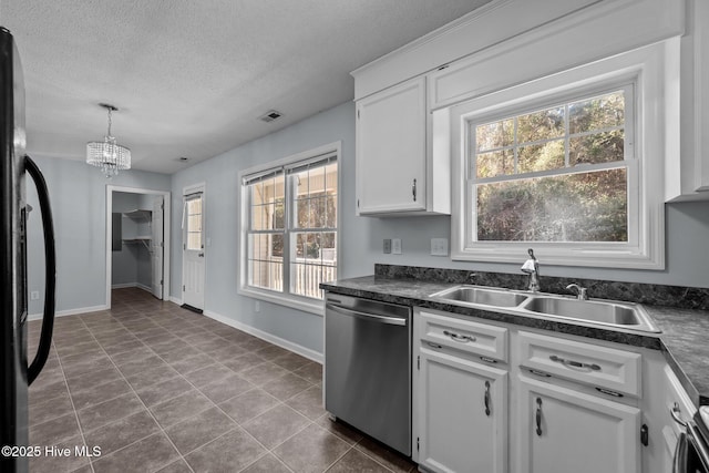 kitchen with sink, hanging light fixtures, black refrigerator, stainless steel dishwasher, and white cabinets