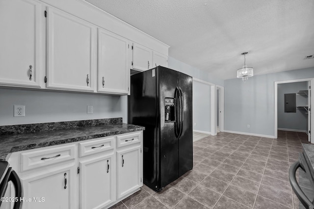 kitchen featuring decorative light fixtures, white cabinetry, stove, electric panel, and black refrigerator with ice dispenser