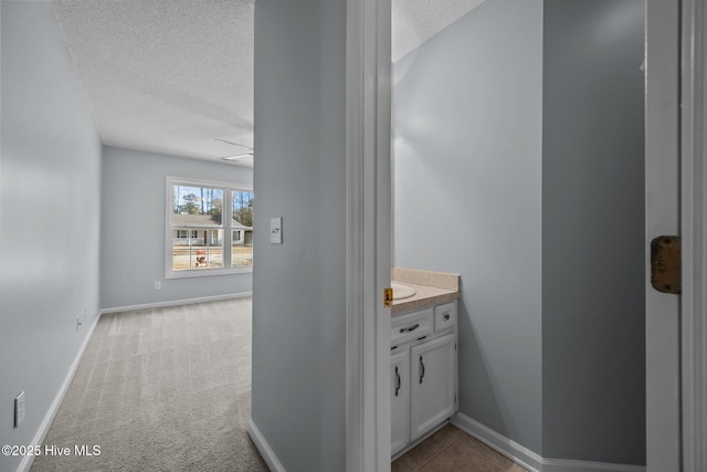 bathroom featuring vanity and a textured ceiling