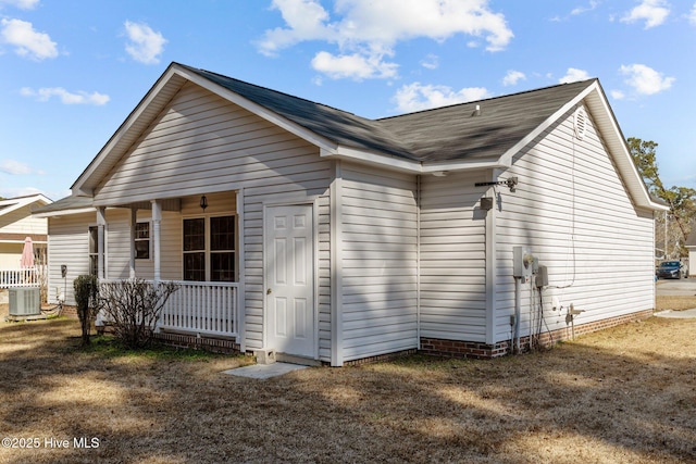 view of home's exterior featuring central AC unit and covered porch