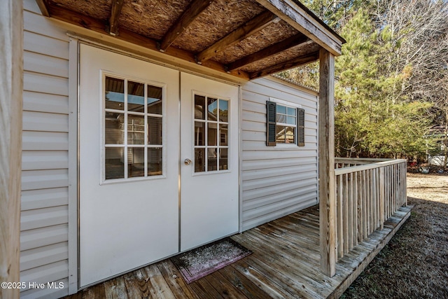 exterior space with french doors and a wooden deck