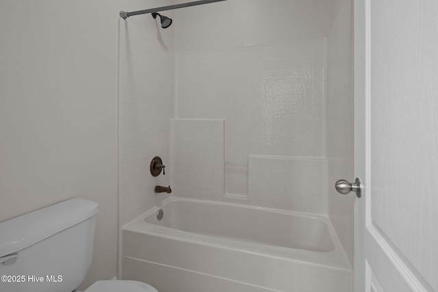 bathroom with toilet and shower / washtub combination