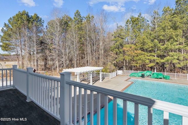 view of swimming pool featuring a pergola