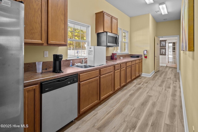 kitchen featuring light hardwood / wood-style floors and stainless steel appliances