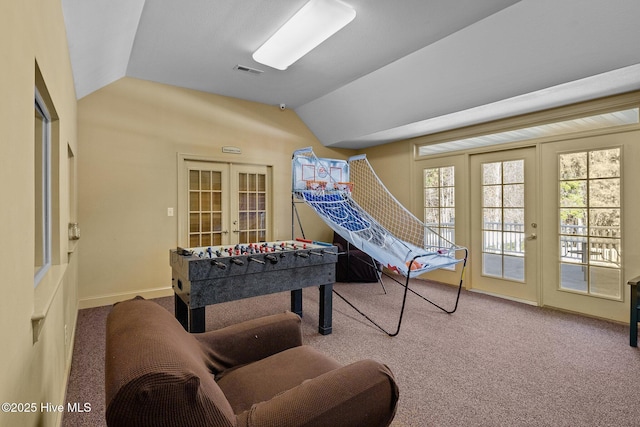 playroom featuring carpet floors, french doors, and vaulted ceiling