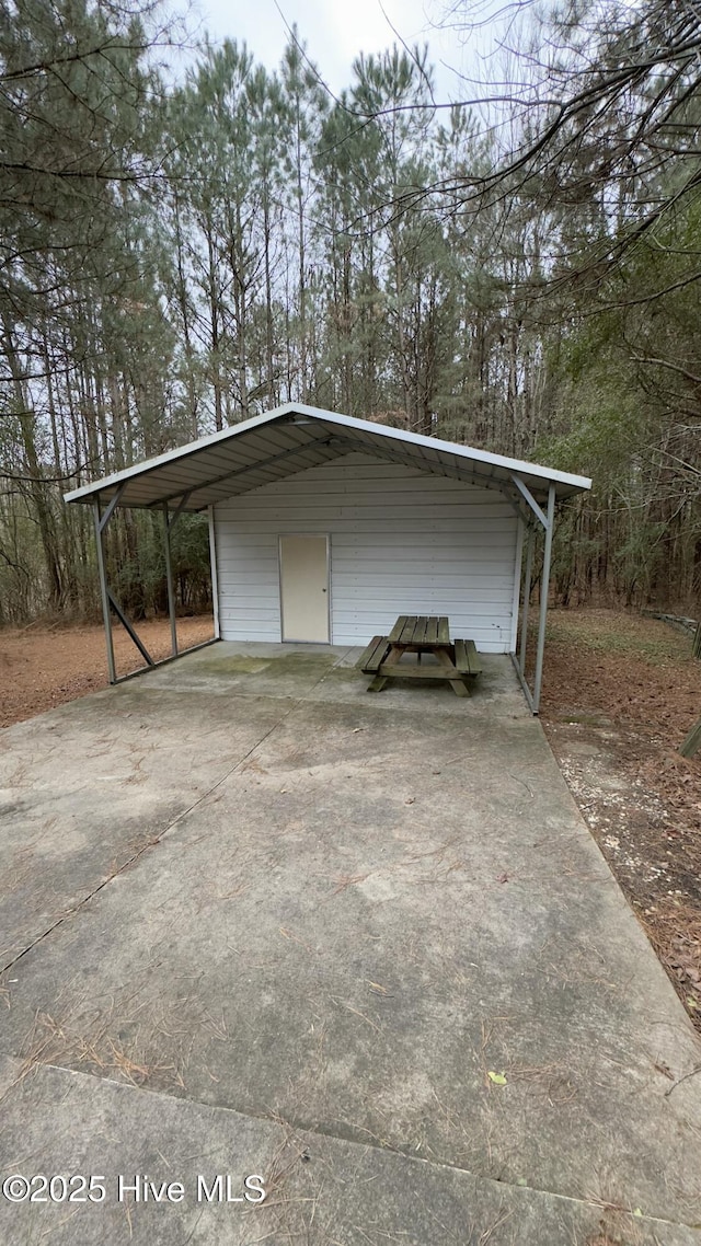 garage featuring a carport