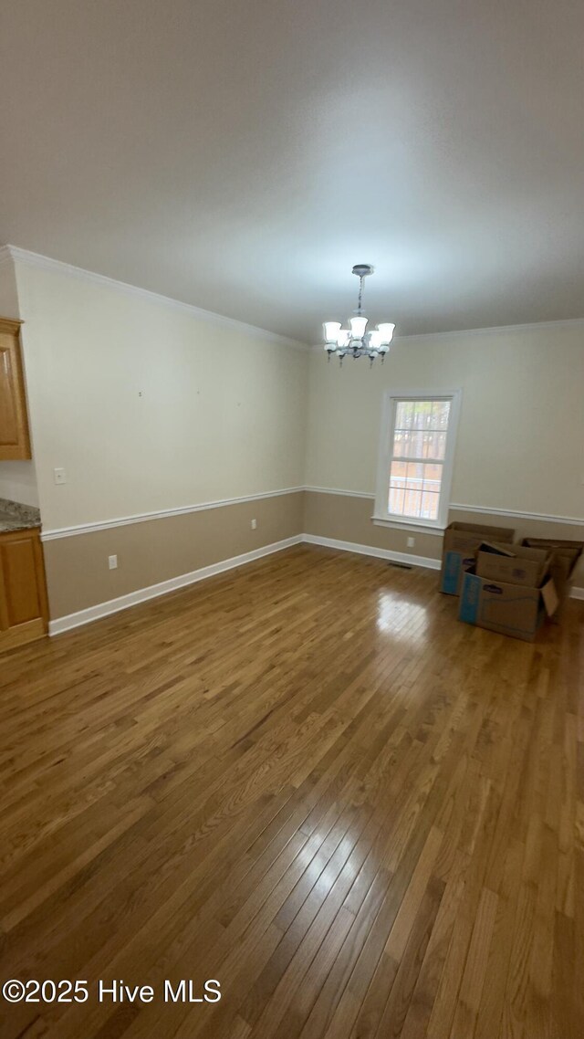 additional living space with vaulted ceiling and light hardwood / wood-style floors