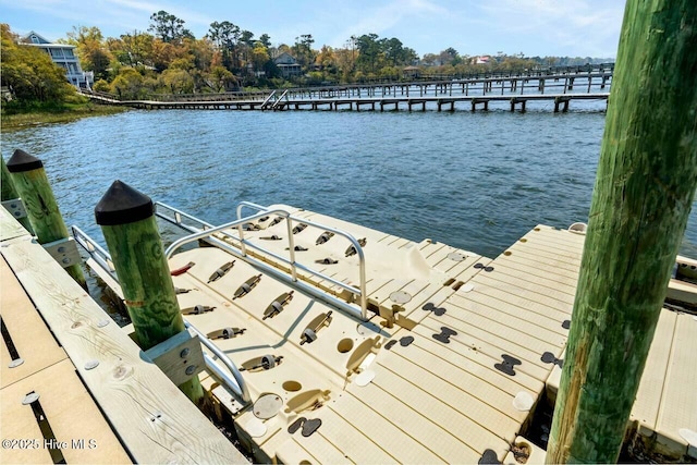 view of dock with a water view