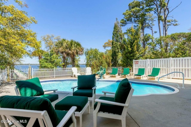 view of swimming pool featuring a patio area