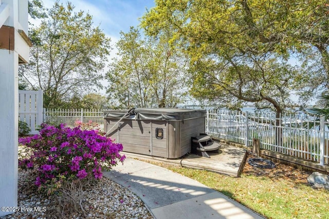 exterior space with a hot tub