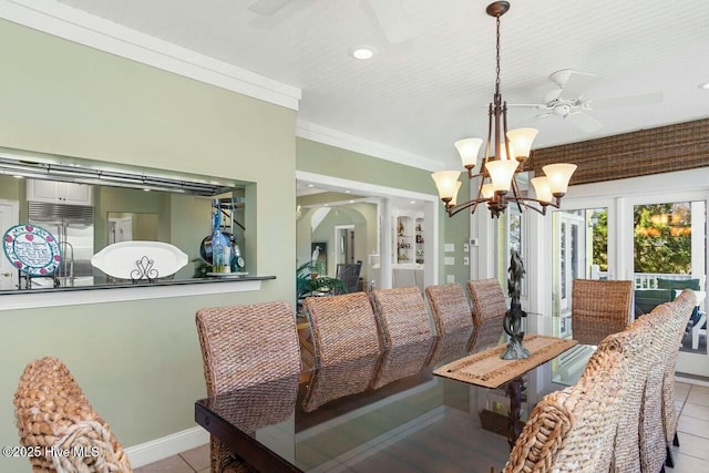 dining area featuring light tile patterned flooring, ornamental molding, and ceiling fan with notable chandelier