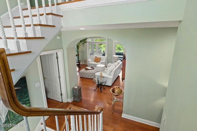 staircase featuring wood-type flooring