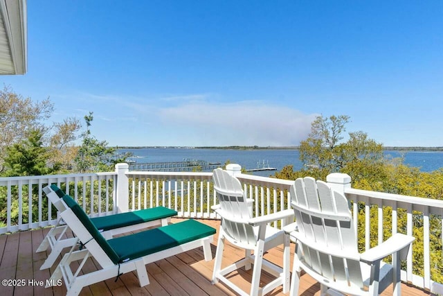 wooden deck with a water view