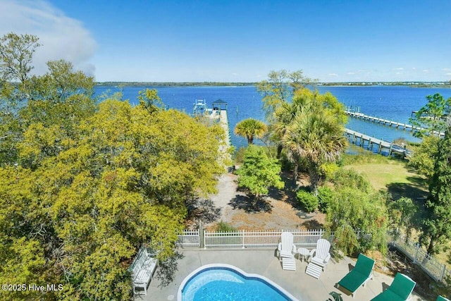 birds eye view of property with a water view