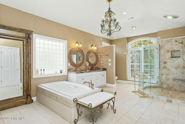 full bathroom featuring toilet, a notable chandelier, plus walk in shower, tile patterned floors, and vanity