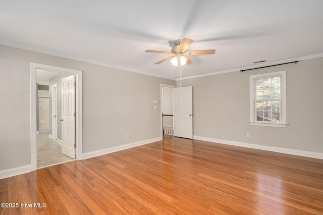 bedroom with crown molding, light hardwood / wood-style floors, and ceiling fan