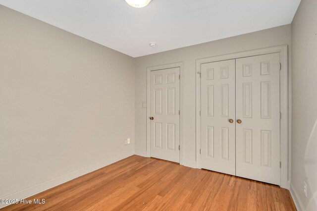 empty room with light hardwood / wood-style floors