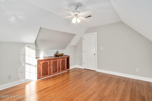 spare room with ceiling fan and hardwood / wood-style floors