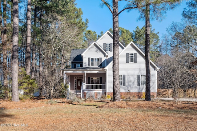 view of front property featuring a front yard and a porch