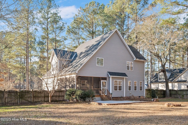 exterior space featuring a front lawn and a sunroom