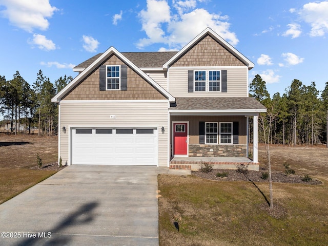 craftsman house with a front lawn, covered porch, and a garage