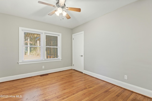 empty room with light hardwood / wood-style floors and ceiling fan