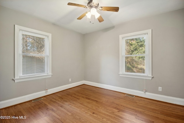 spare room with ceiling fan and hardwood / wood-style floors